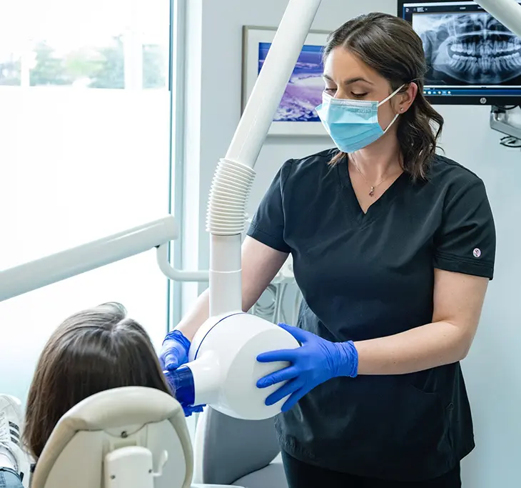 Dental professional taking digital dental X-rays for a patient at Dr. Sara Syed Dentistry
